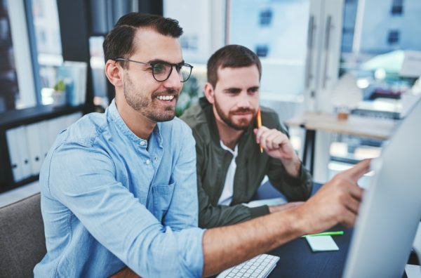 Two men at a computer screen